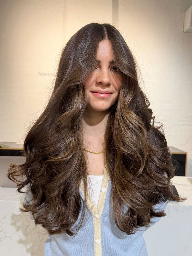 8. Blowout Layers with Curtain Bangs