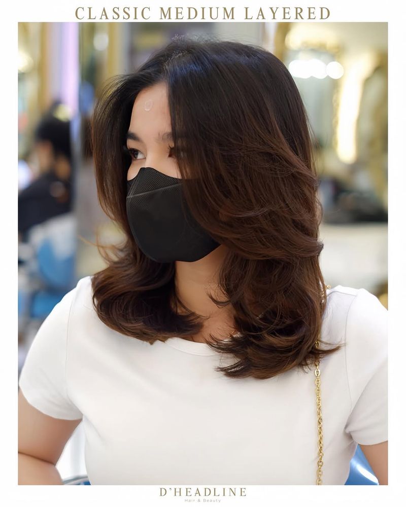 50. Blowout Layers with Soft Curtain Bangs