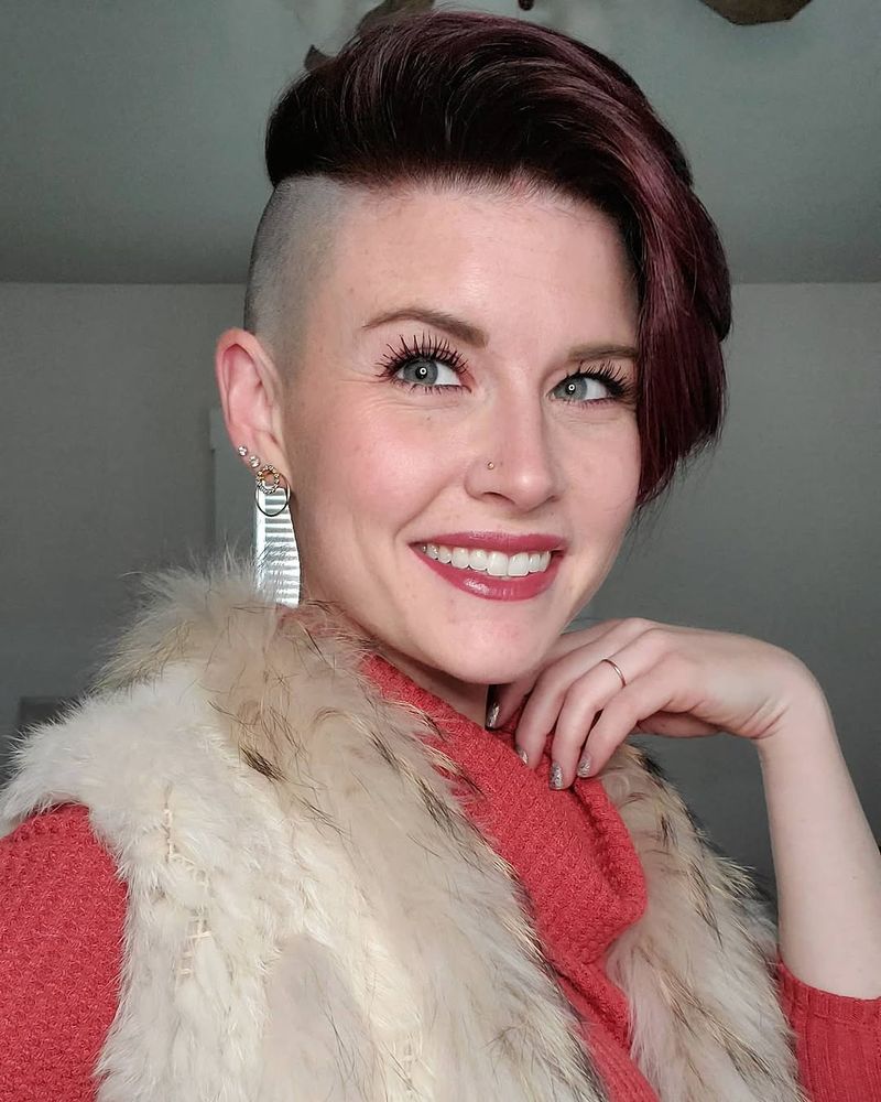 73. Burgundy Side-Swept Pixie with Shaved Sides