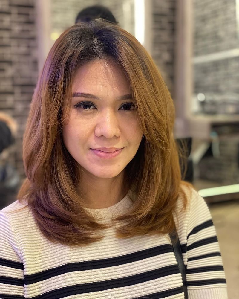7. Caramel Blowout with Soft Curtain Fringe