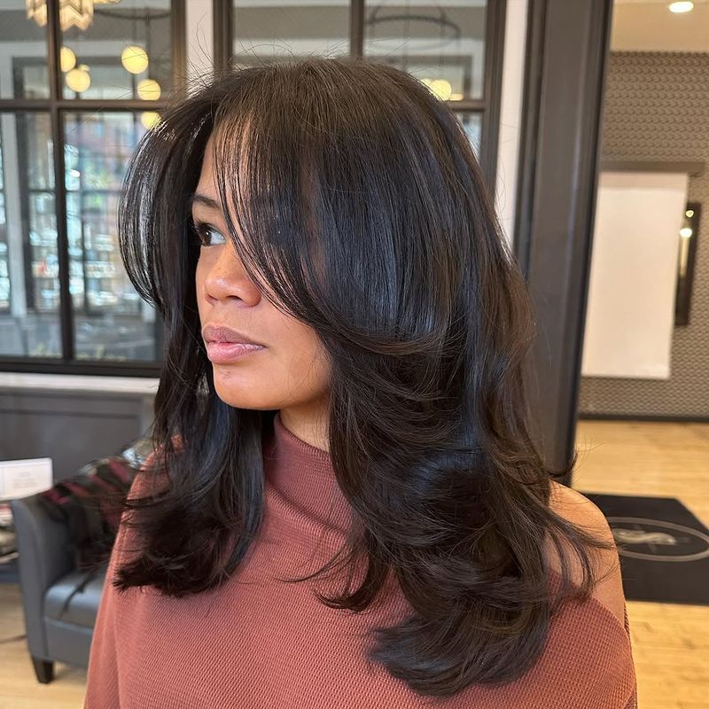 61. Feathered Layers with Wispy Bangs