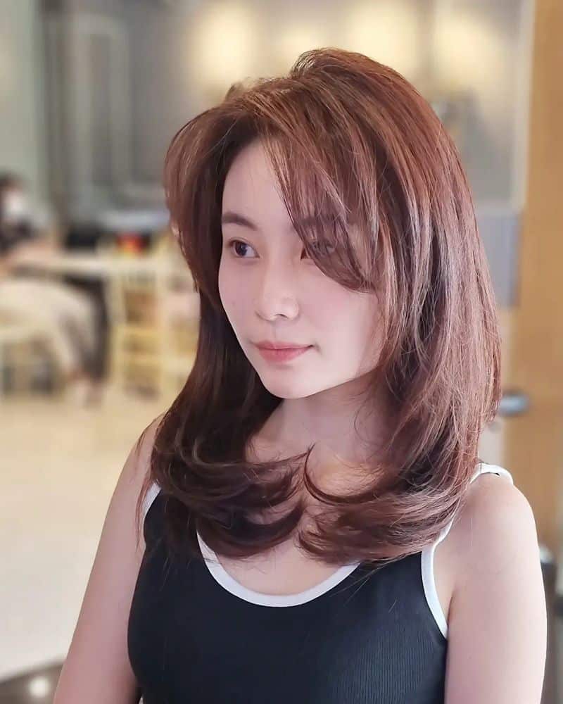 41. Flipped Layered Lob with Sweeping Side Bangs