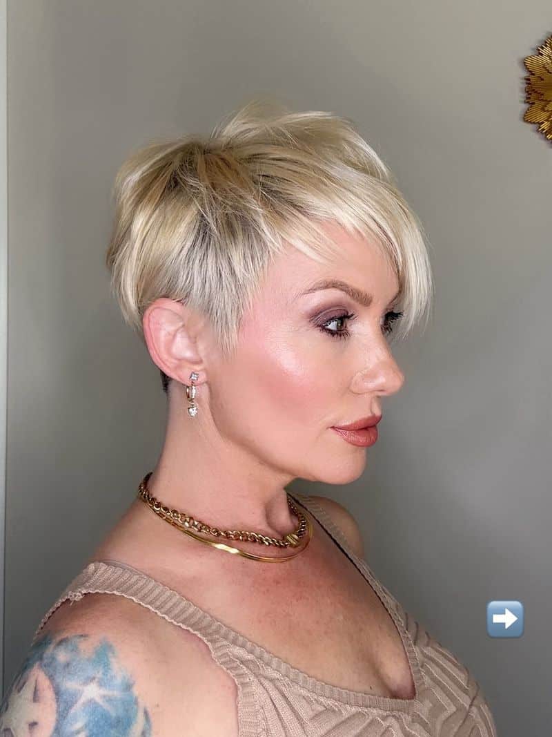 69. Platinum Undercut with Sweeping Side Bangs