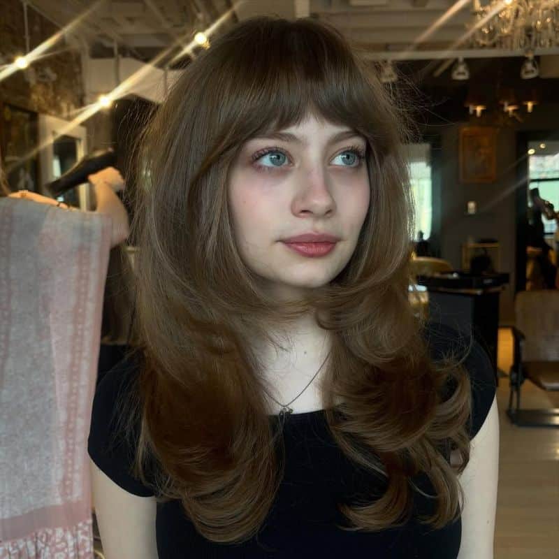 59. Retro Blowout Layers with Full Bangs