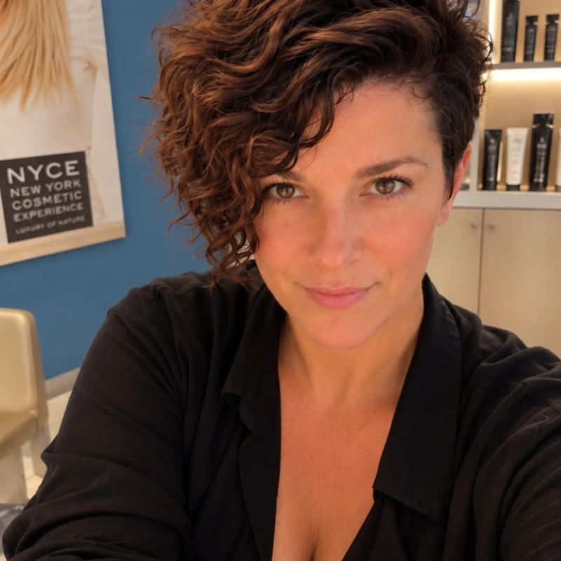 15. Side-Swept Curls with Undercut