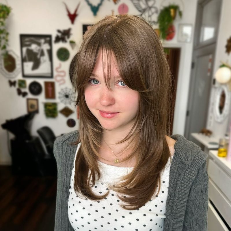 33. Soft Layered Cut with Curtain Bangs