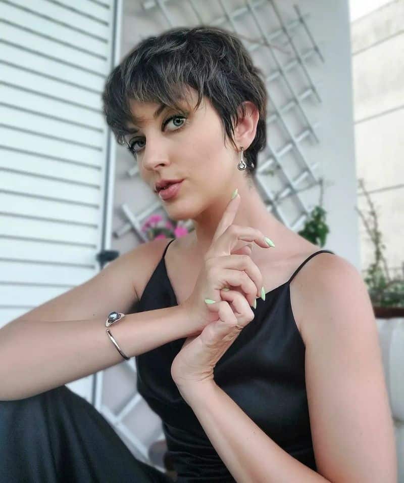 30. Tapered Brunette Pixie with Wispy Bangs