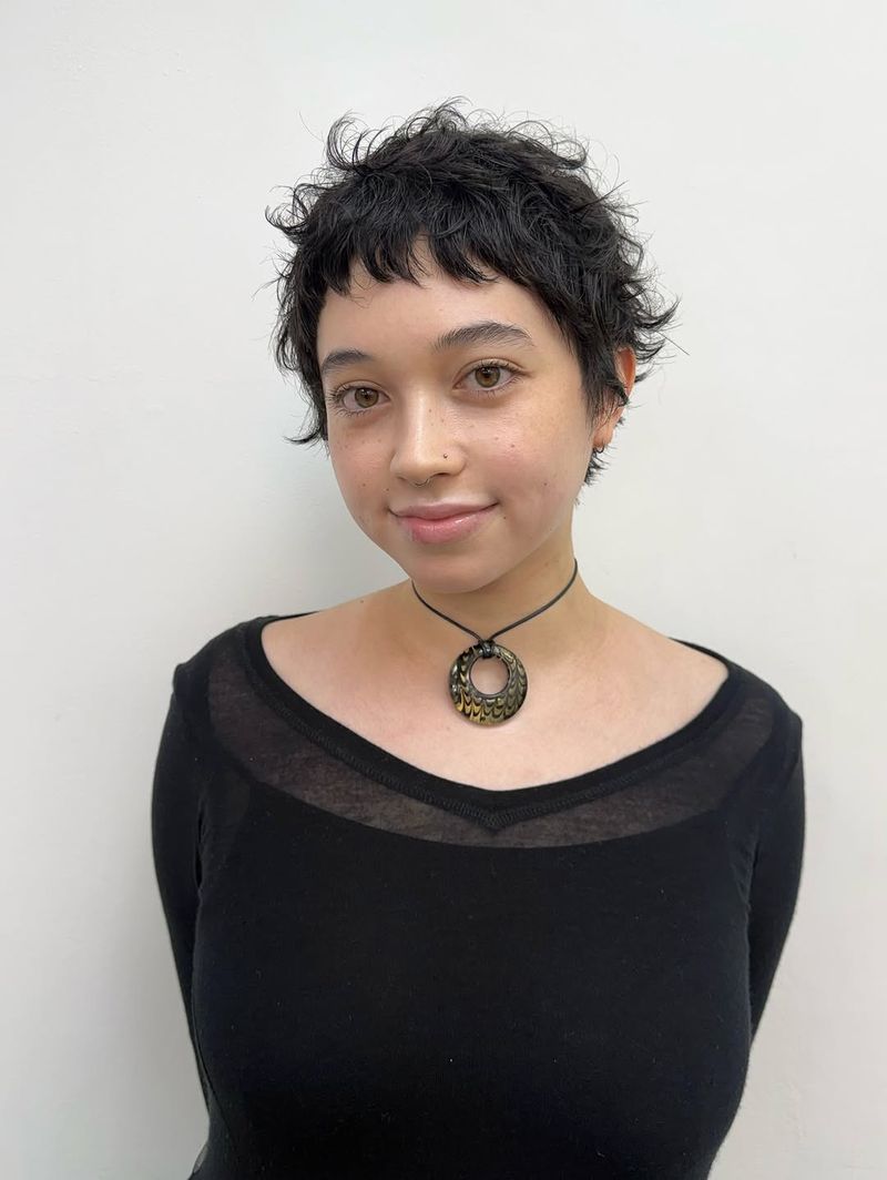 48. Tousled Micro-Bangs and Textured Black Pixie